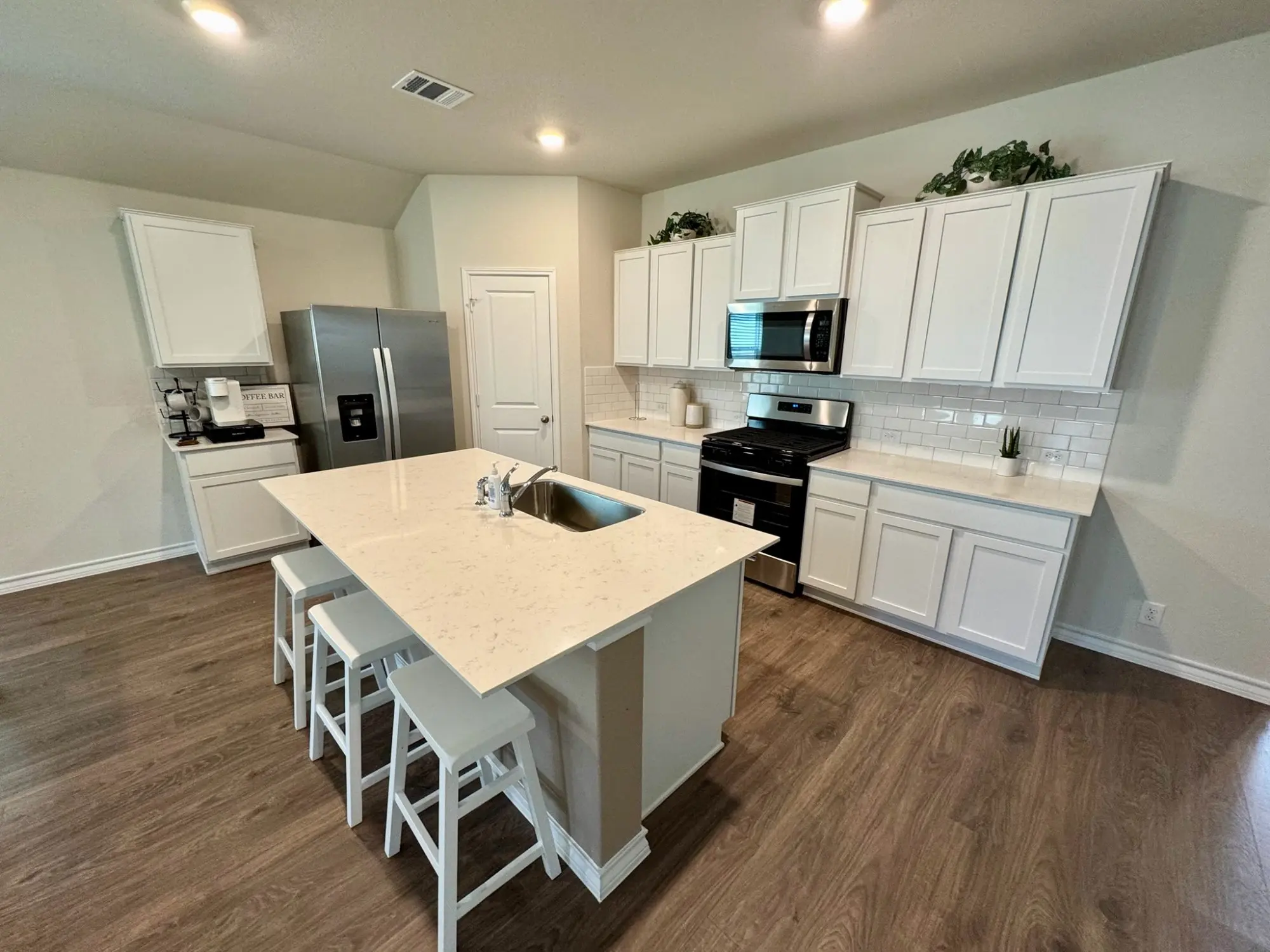 Full kitchen with island at Comfort Care Home